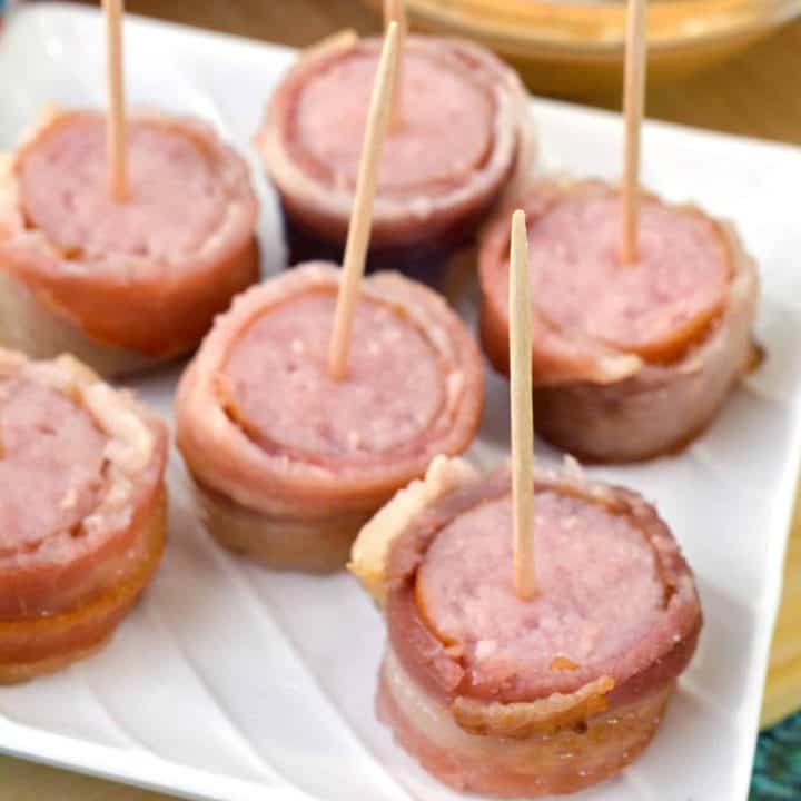 Bacon Wrapped Brats with Beer Cheese Sauce